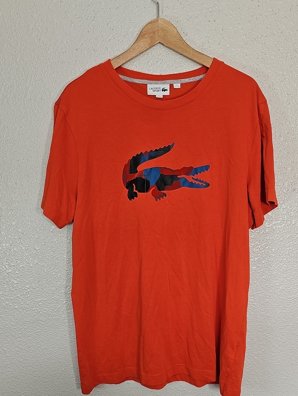 Lacoste Orange Tee with Croc Graphic.